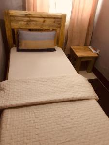 Ένα ή περισσότερα κρεβάτια σε δωμάτιο στο Tulivu house