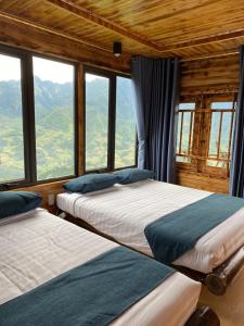 Voodi või voodid majutusasutuse Laochai moutian view sapa toas +42 fotot