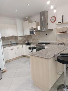 Η κουζίνα ή μικρή κουζίνα στο Pleasant apartment, ideal for your stays