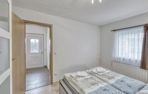 Postel nebo postele na pokoji v ubytování Ferienhaus Bansin Seebad + 4 fotografie