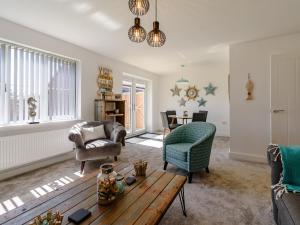 a living room with a couch and a table at The Light House in Flamborough