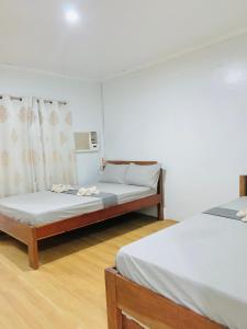 Ένα ή περισσότερα κρεβάτια σε δωμάτιο στο Krizma Inn