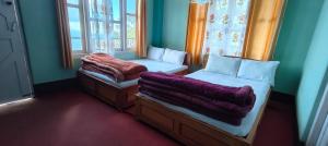 Postel nebo postele na pokoji v ubytování Chander Pahar Retreat