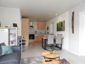 a living room with a couch and a table at Ferienwohnung "Schöne Aussicht" in Reil