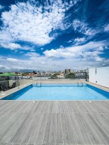 a swimming pool on the roof of a building at Dateheight Apt in Lekki