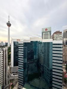 a view of a tall building with a tower at Crystal Suites at Ramad KLCC in Kuala Lumpur