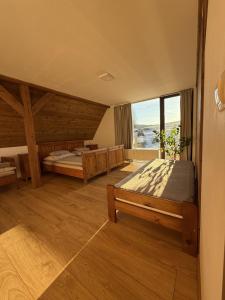 Postel nebo postele na pokoji v ubytování Chalupa Bartlův Dvůr + 30 fotografií