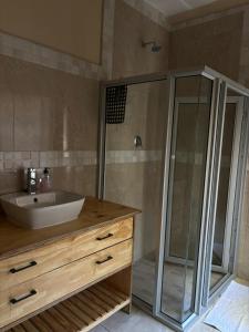 a bathroom with a sink and a shower at Laroza guest house in Rustenburg +6 photos