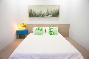 Ένα ή περισσότερα κρεβάτια σε δωμάτιο στο NGHI Homestay