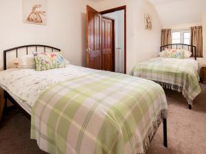 En eller flere senge i et værelse på Dunstanburgh View + 4 billeder