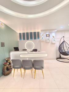 a dressing room with a white table and chairs at Private room & attached washroom 102 , Zero mile in Patna