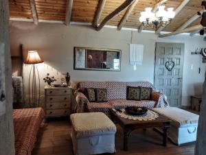 a living room with a couch and a table at Neraida House in Elliniko