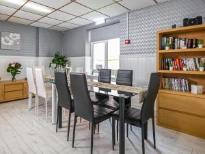 a dining room with a table and chairs at The Ascot in Blackpool