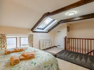 a bedroom with a bed and a skylight at Orchard Cottage - Uk30437 in Kingsbury Episcopi