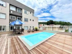 La alberca dentro o cerca de Apartamento 104 B com Piscina em Bombinhas