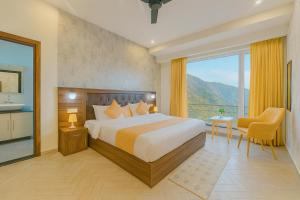 a hotel room with a bed and a balcony at Doon Nature Valley Resort, Mussoorie in Mussoorie