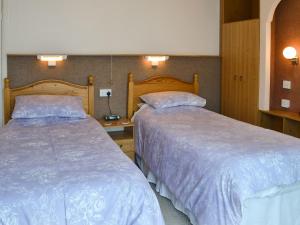 Ένα ή περισσότερα κρεβάτια σε δωμάτιο στο Greenhaven