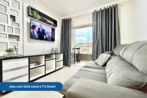 Una televisión o centro de entretenimiento en Apartamento 104 B com Piscina em Bombinhas