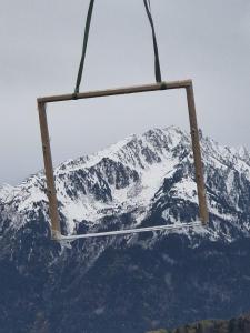 a snow covered mountain in front of a ski lift at Les chalets Super Geants in Saint-François-Longchamp