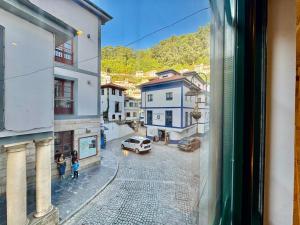 a view from a window of a city street at Gestviva Casa Urbanin I in Cudillero