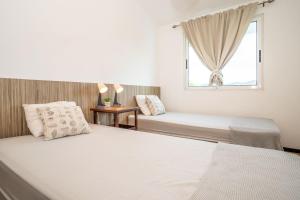 Postel nebo postele na pokoji v ubytování Piece of Paradise + 42 fotografií