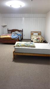 Ένα ή περισσότερα κρεβάτια σε δωμάτιο στο Minpaku ayu B