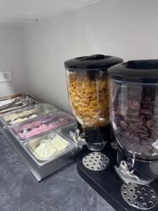 a counter top with a blender and some food at Hotel Wayteko San Antón in Alicante