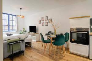 TV a/nebo společenská místnost v ubytování Le Logis Des Remparts Appartement neuf