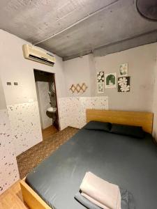 a bedroom with a large bed and a bathroom at Ubuntu Sky view 139 Hang Bac in Hanoi