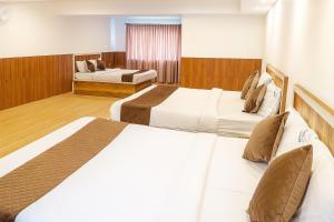 Ένα ή περισσότερα κρεβάτια σε δωμάτιο στο Hillcrest Metro