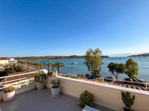 a view of the water from the balcony of a building at Sea Breeze - Home with a View in Bouzéïka