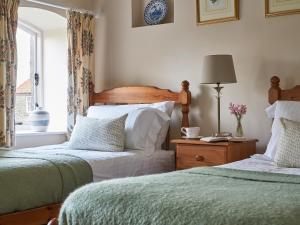 En eller flere senge i et værelse på Rosedale