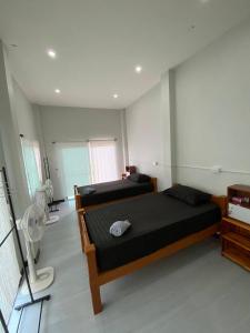 Postel nebo postele na pokoji v ubytování Phu Aunna + 72 fotografií