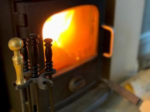 a close up of a candle in a candle at Gilbertson Cottage in Wheldrake