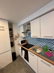 Kuchyň nebo kuchyňský kout v ubytování Au Silo