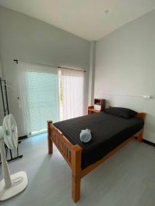 Postel nebo postele na pokoji v ubytování Phu Aunna