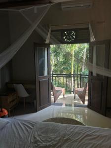 Ένα ή περισσότερα κρεβάτια σε δωμάτιο στο Bakamuna Coliving Villa near Hiriketiya +39 φωτογραφίες