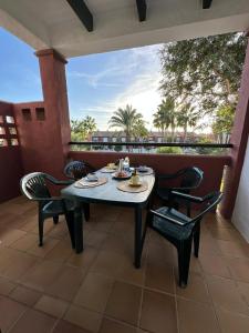 En balkon eller terrasse på Apartamento La Barrosa - Aldea del Coto