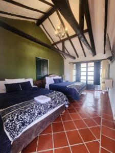 Ένα ή περισσότερα κρεβάτια σε δωμάτιο στο Hotel Posada SantaMaria Villa de Leyva
