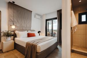 Postel nebo postele na pokoji v ubytování Kalea Luxury Villas