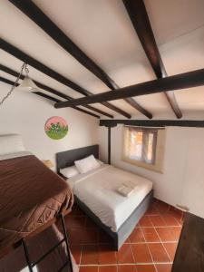 Ένα ή περισσότερα κρεβάτια σε δωμάτιο στο Hotel Posada SantaMaria Villa de Leyva +6 φωτογραφίες