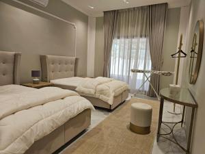 Ένα ή περισσότερα κρεβάτια σε δωμάτιο στο hatta sky