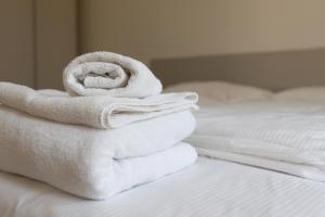 Postel nebo postele na pokoji v ubytování Astoria Guest House