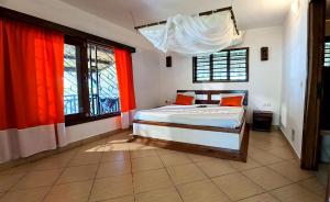 Postel nebo postele na pokoji v ubytování Villa Makoa