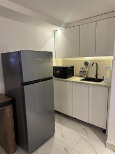 Η κουζίνα ή μικρή κουζίνα στο Asokoro Luxury Apartments +39 φωτογραφίες