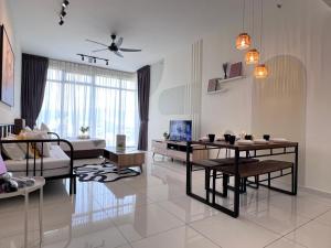 a living room with a couch and a table at Georgetown#Beacon Executive Suite SkyPool#Modern & Elegant Suite# in George Town