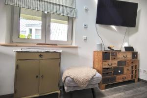 TV a/nebo společenská místnost v ubytování Haus Swanhild + 47 fotografií