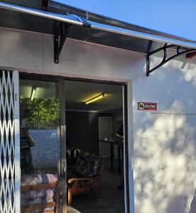 a view of a garage with awning over the door at Lalapanzi Accommodation in Vosburg