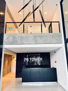 a lobby with an imtn tower sign on the wall at Studio 16 Neuquén in Neuquén +10 photos