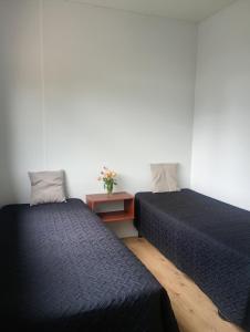 Ένα ή περισσότερα κρεβάτια σε δωμάτιο στο Container House